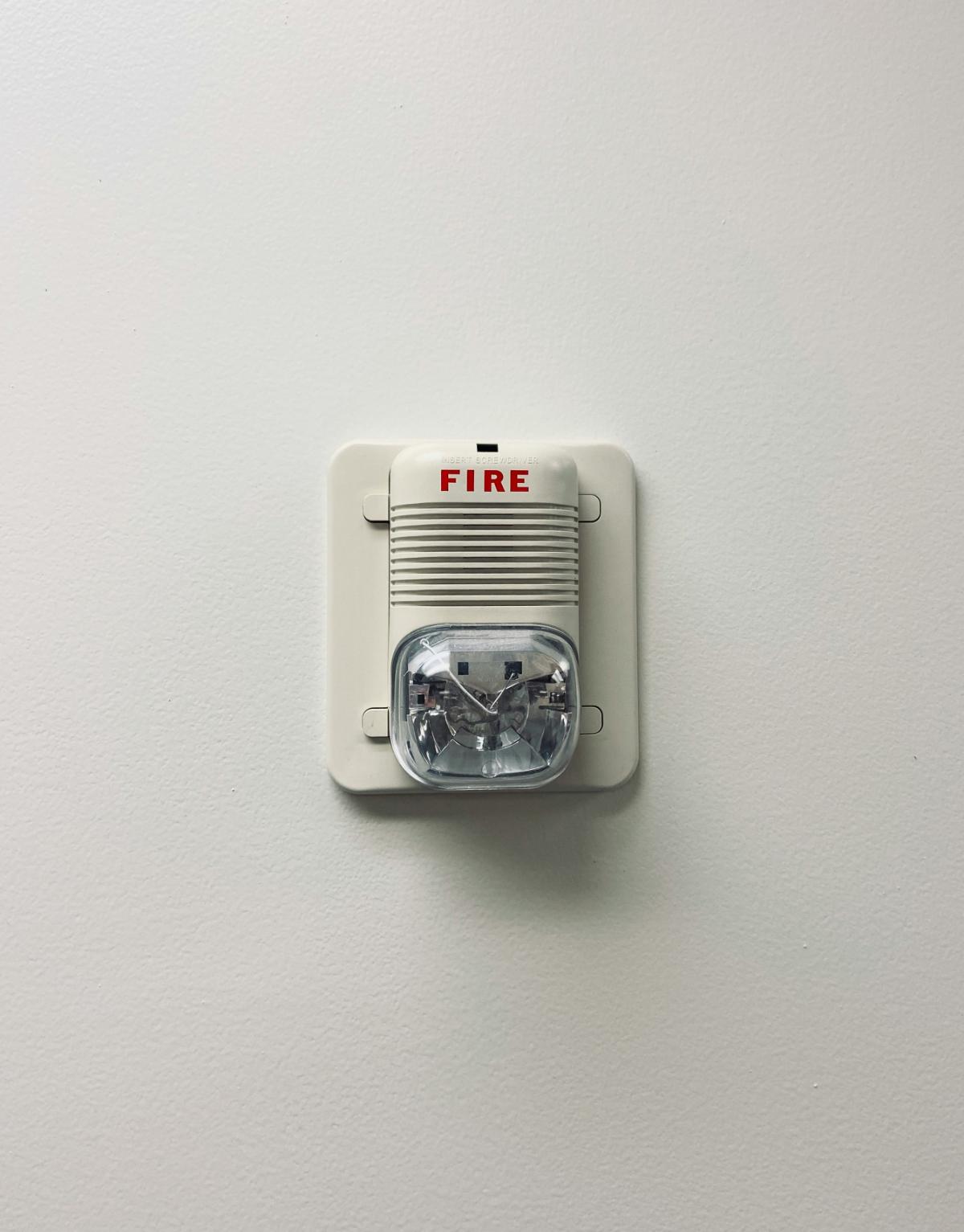 Fire alarm mounted on a wall